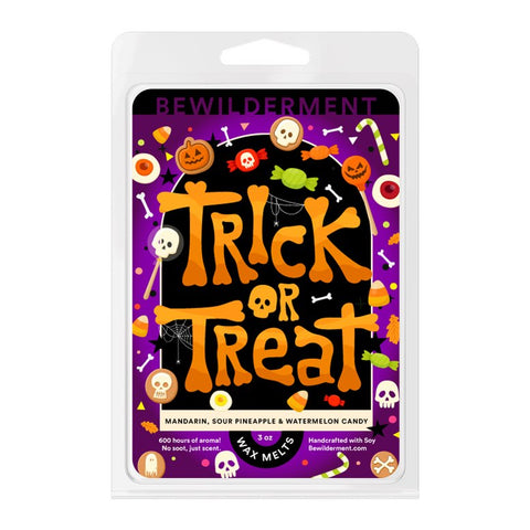 Halloween-themed wax melts packaging with orange "Trick or Treat" text, candy, skulls, and pumpkins on a purple background.