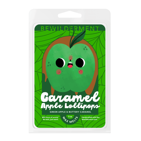 Green apple-shaped wax melts with caramel dripping effect in clear clamshell packaging labeled "Caramel Apple Lollipops".
